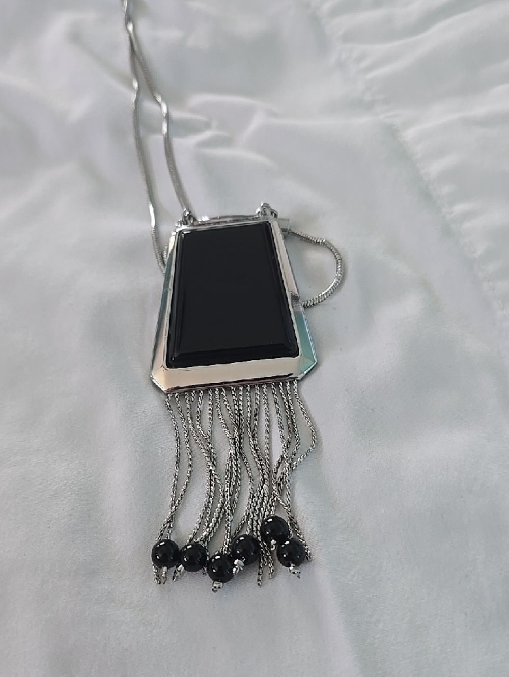 Silver-Tone Necklace with Black Pendant and Fringe